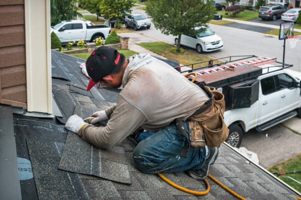 Professional Roofing technician working in Westdale, NY
